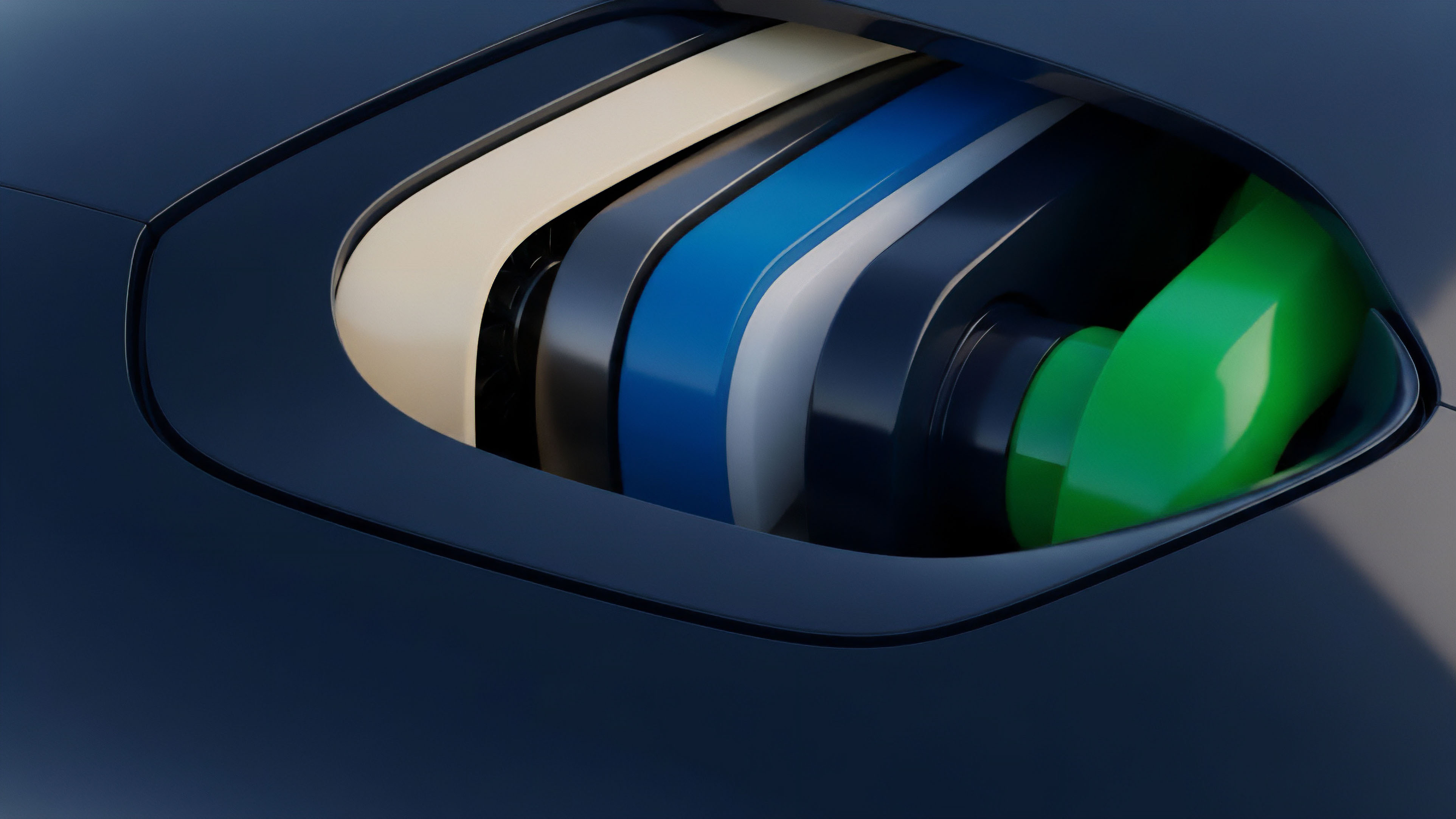 A close-up view reveals a stylized, layered inlet or vent on a dark blue, smooth surface. The structure consists of several rounded elements, transitioning in color from a beige outer layer to dark blue, white, and culminating in a vibrant green inner component