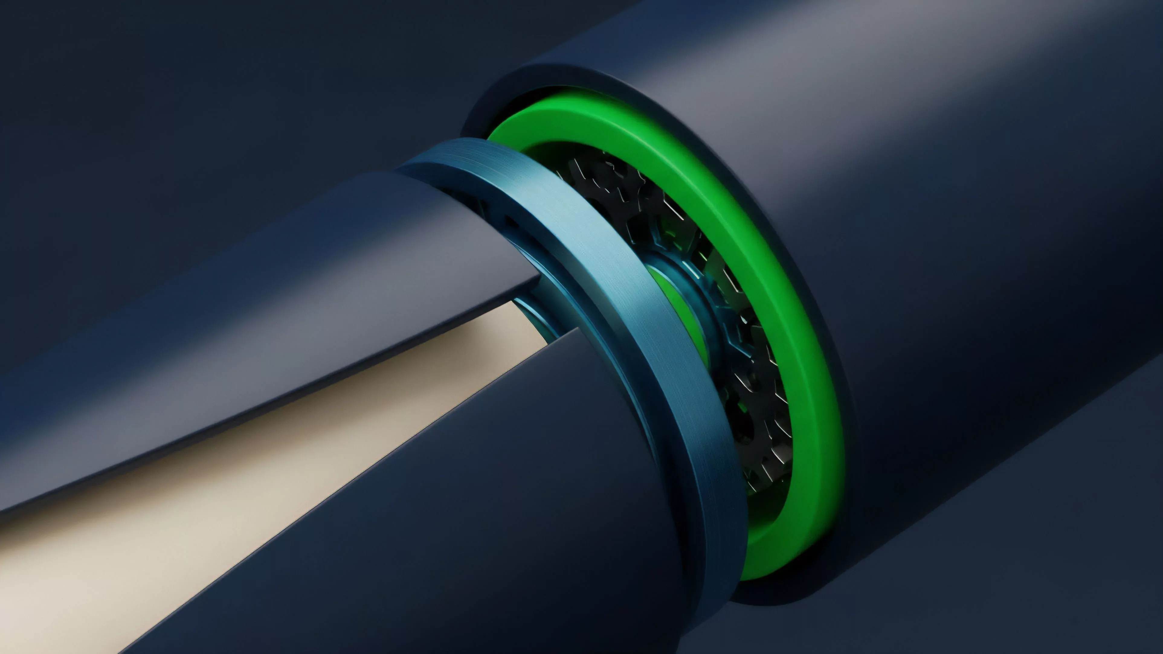 A close-up view shows two cylindrical components in a state of separation. The inner component is light-colored, while the outer shell is dark blue, revealing a mechanical junction featuring a vibrant green ring, a blue metallic ring, and underlying gear-like structures