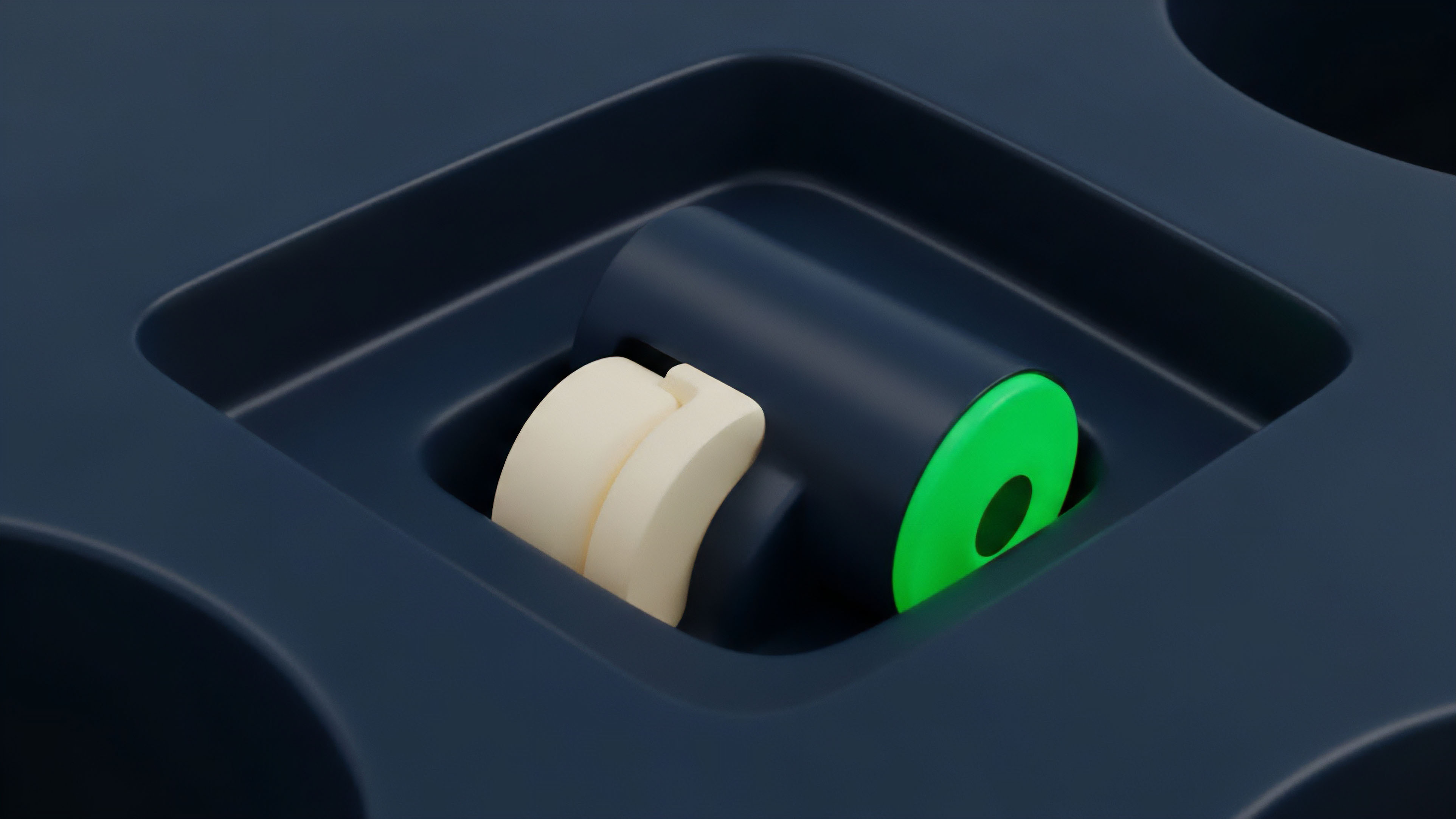 A close-up view reveals a dark blue mechanical structure containing a light cream roller and a bright green disc, suggesting an intricate system of interconnected parts. This visual metaphor illustrates the underlying mechanics of a decentralized finance DeFi derivatives protocol, where automated processes govern asset interaction