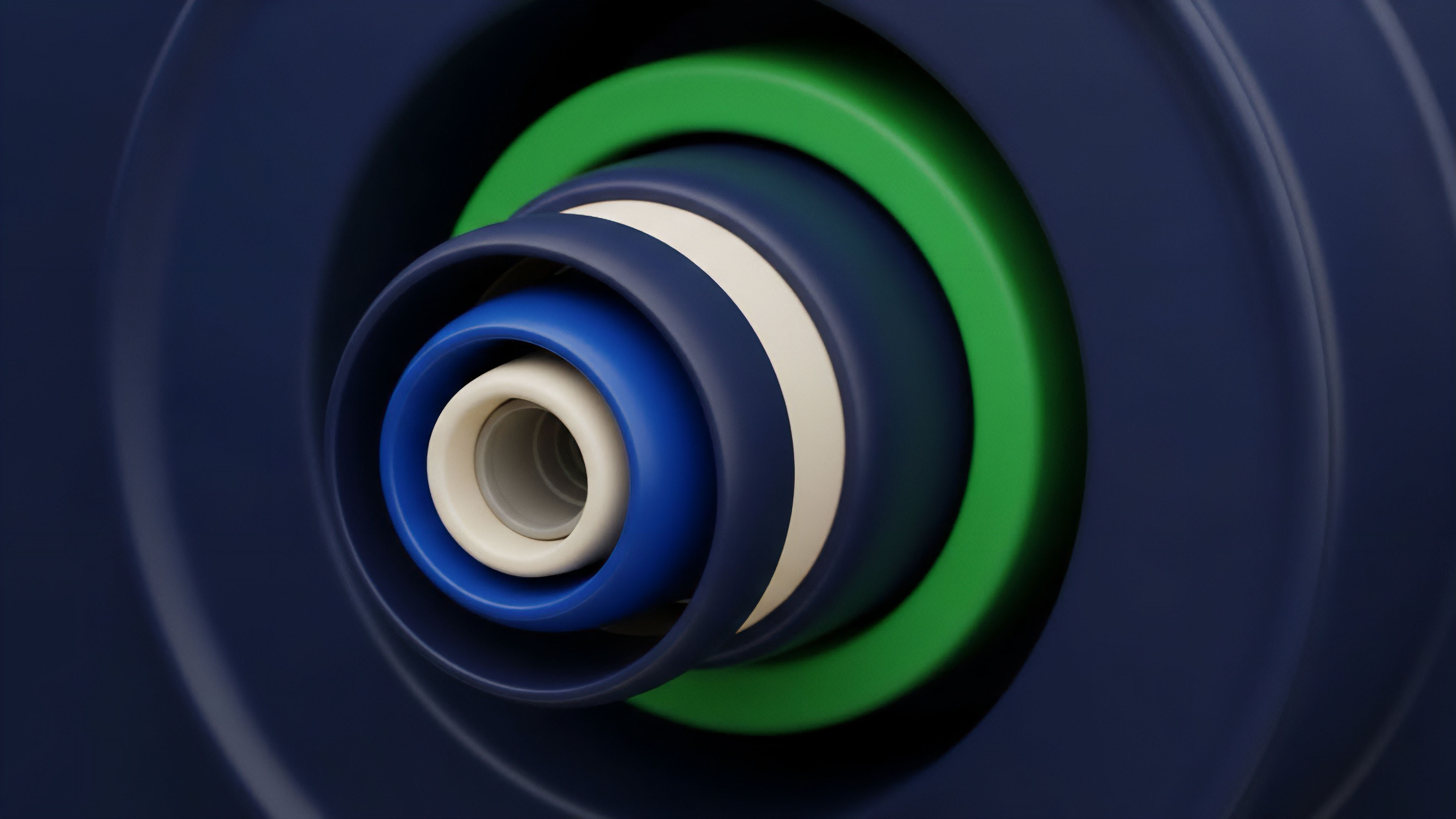 A series of concentric cylinders, layered from a bright white core to a vibrant green and dark blue exterior, form a visually complex nested structure. The smooth, deep blue background frames the central forms, highlighting their precise stacking arrangement and depth