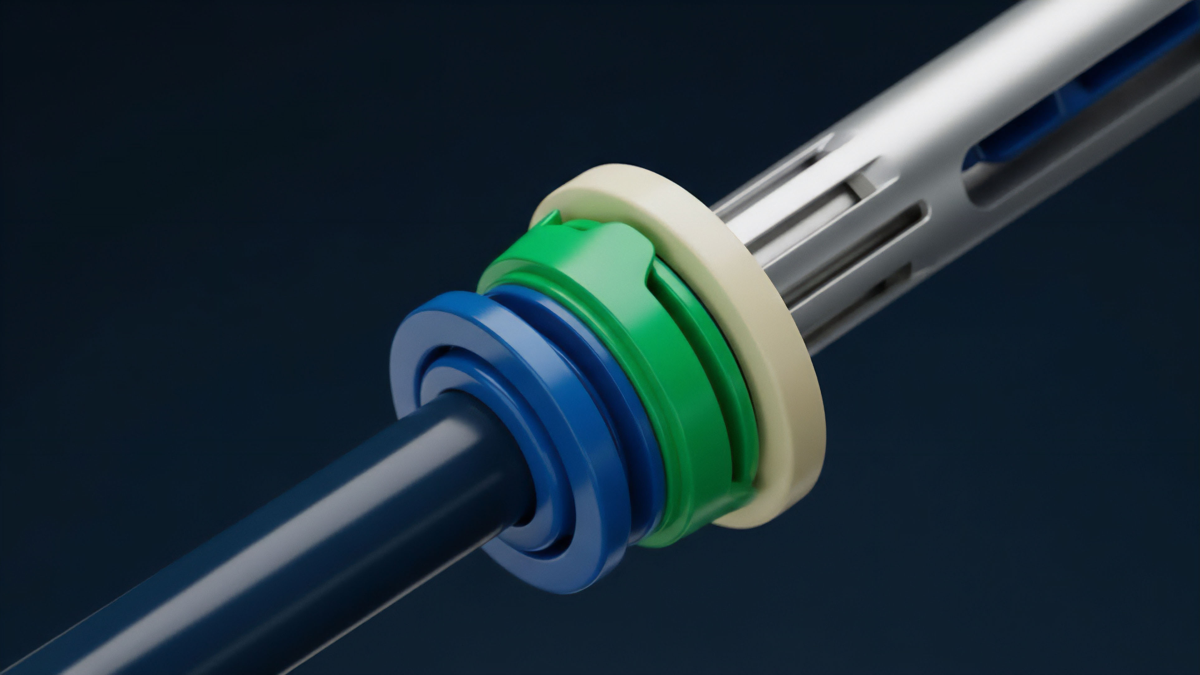 A close-up view shows a precision mechanical coupling composed of multiple concentric rings and a central shaft. A dark blue inner shaft passes through a bright green ring, which interlocks with a pale yellow outer ring, connecting to a larger silver component with slotted features