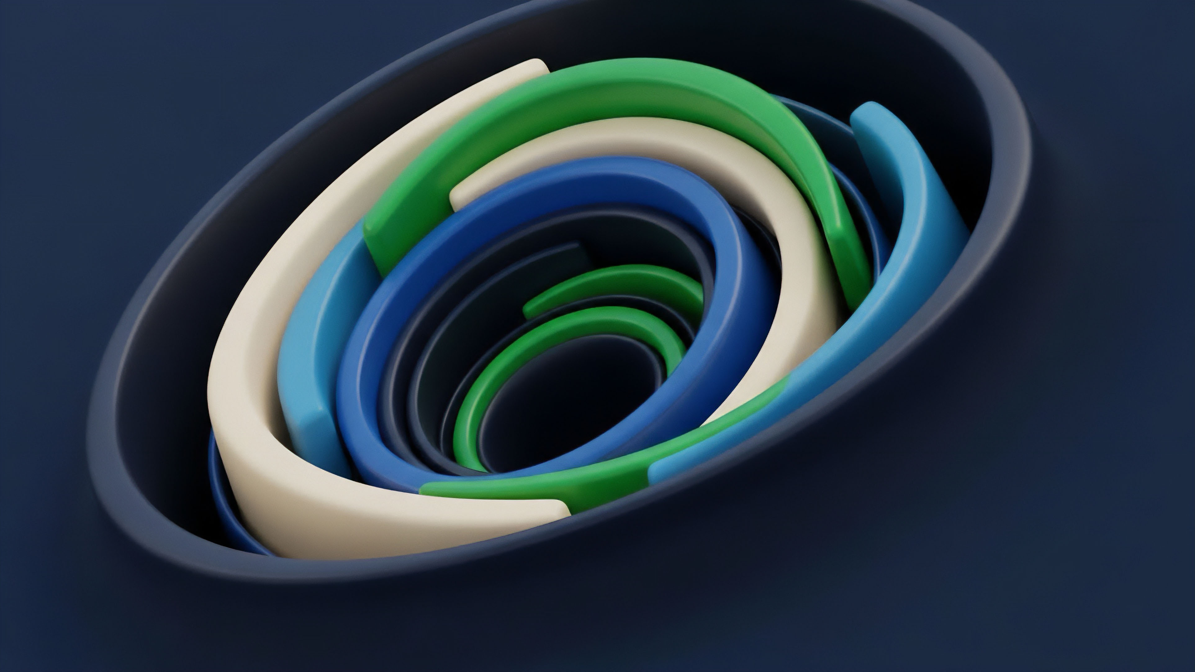 A close-up view of nested, ring-like shapes in a spiral arrangement, featuring varying colors including dark blue, light blue, green, and beige. The concentric layers diminish in size toward a central void, set within a dark blue, curved frame