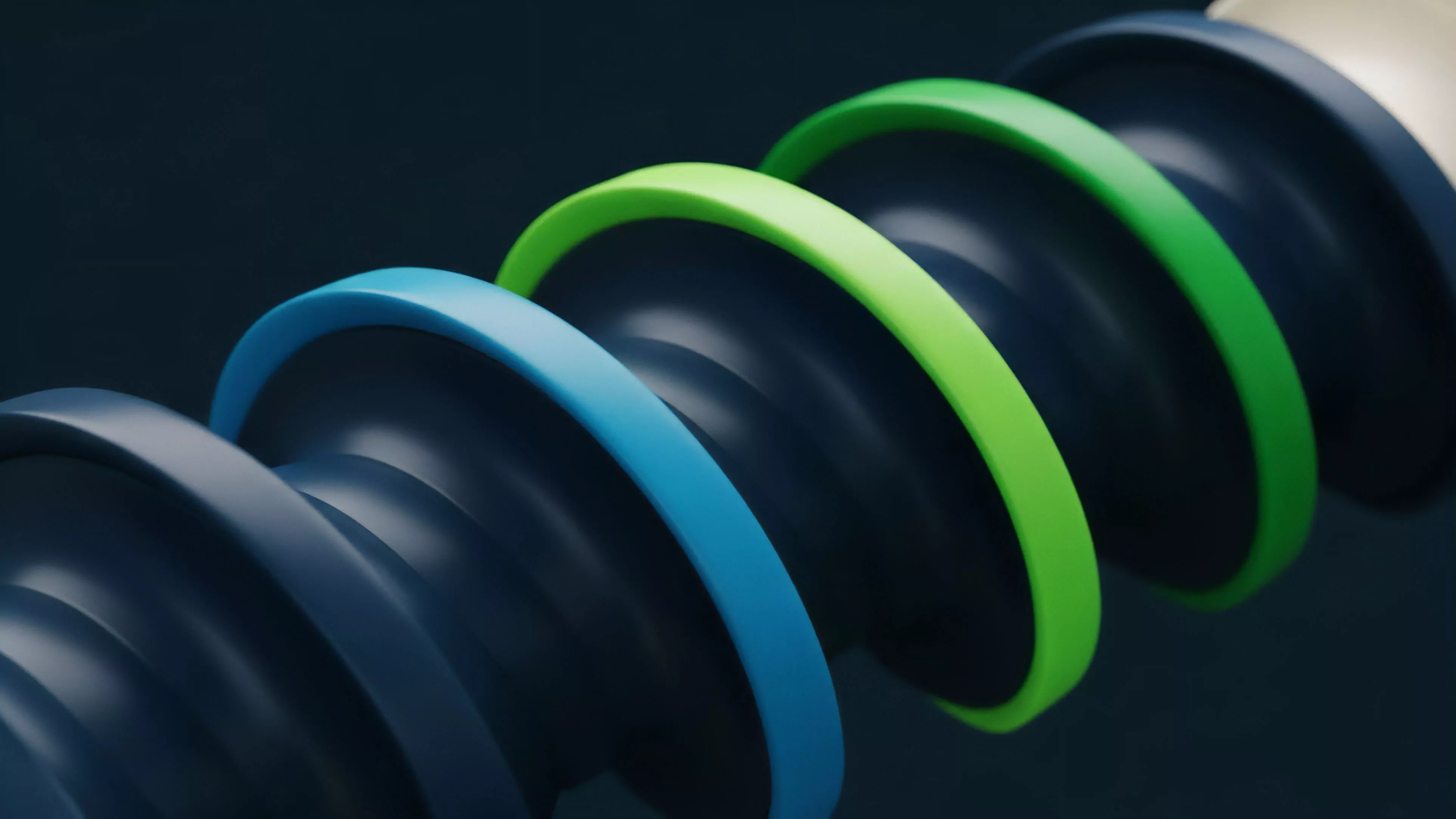 The visual features a series of interconnected, smooth, ring-like segments in a vibrant color gradient, including deep blue, bright green, and off-white against a dark background. The perspective creates a sense of continuous flow and progression from one element to the next, emphasizing the sequential nature of the structure