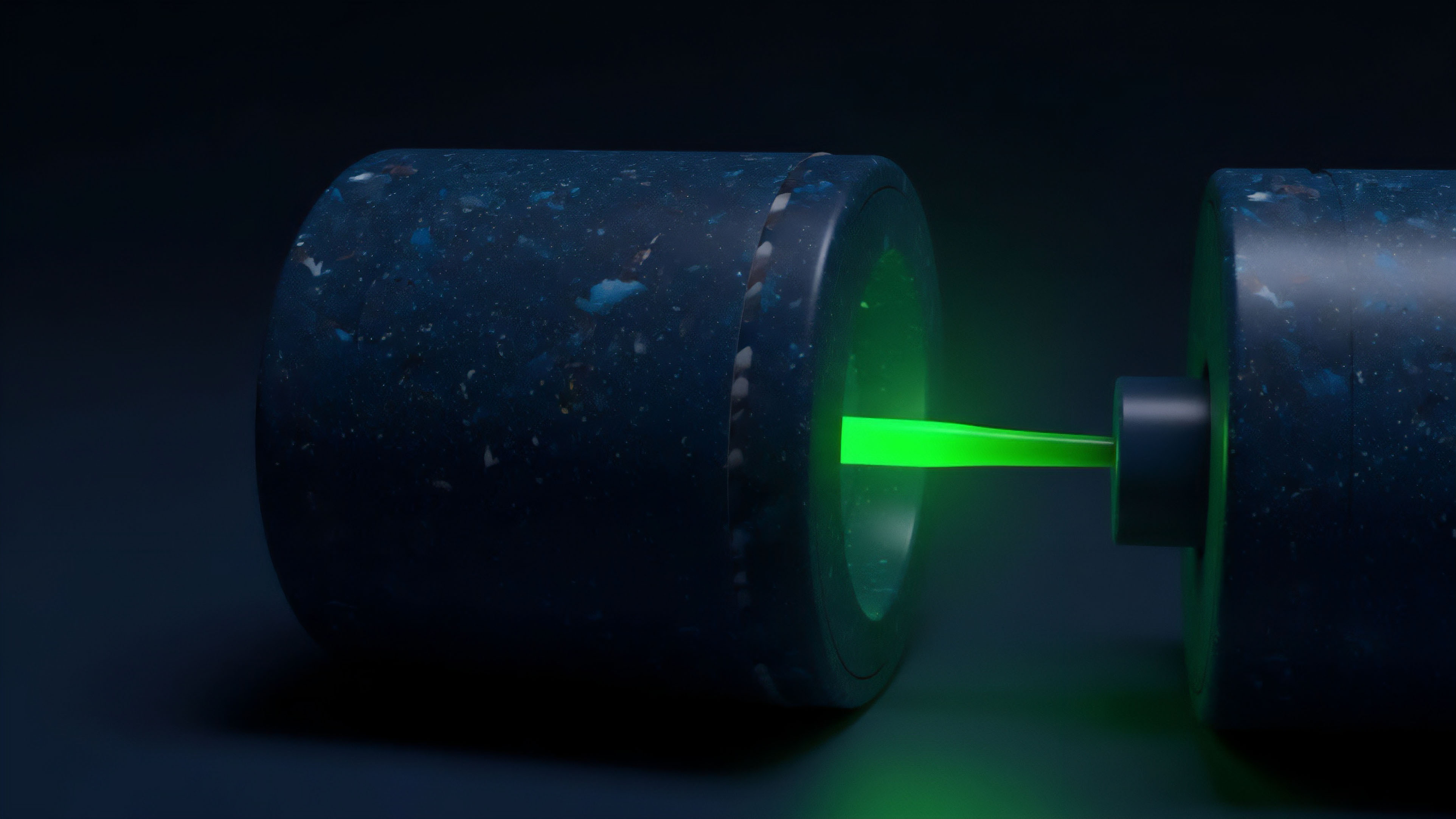 A close-up view shows two dark, cylindrical objects separated in space, connected by a vibrant, neon-green energy beam. The beam originates from a large recess in the left object, transmitting through a smaller component attached to the right object